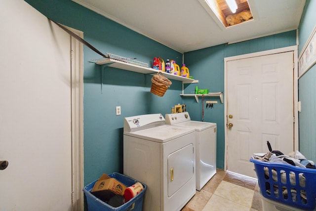 washroom featuring washing machine and clothes dryer and light tile patterned flooring