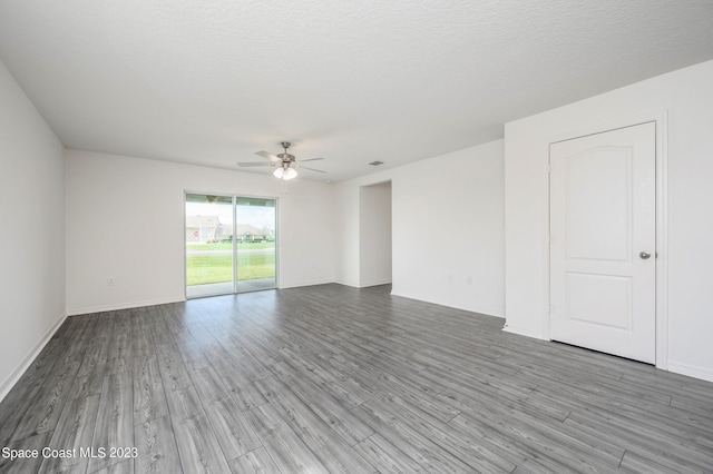 empty room featuring wood-type flooring, a textured ceiling, and ceiling fan