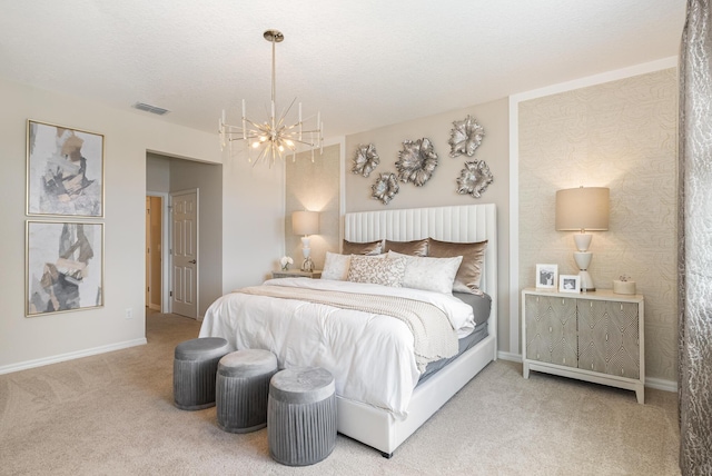 bedroom featuring an inviting chandelier, carpet flooring, and a textured ceiling