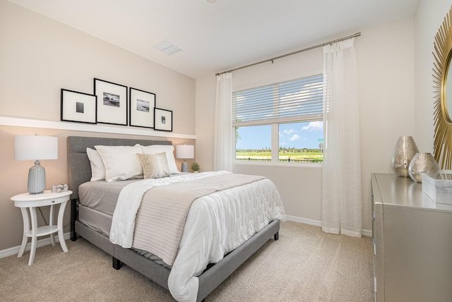 bedroom with light colored carpet