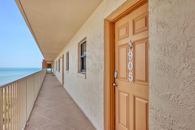 view of exterior entry featuring a water view