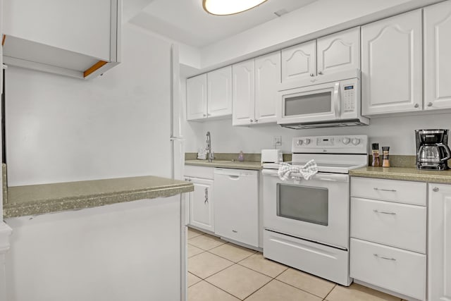 kitchen featuring white cabinetry, sink, light tile patterned flooring, and white appliances