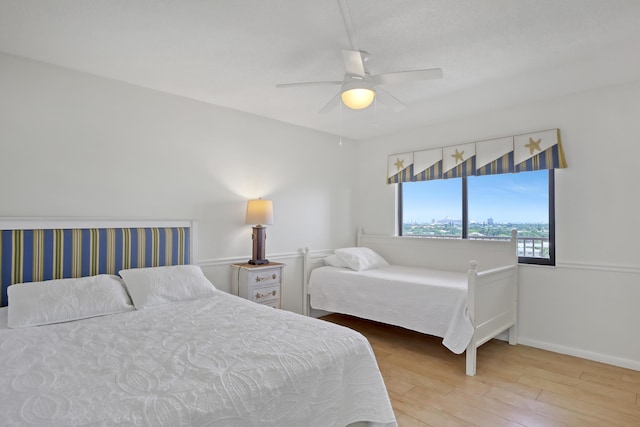 bedroom featuring ceiling fan and light hardwood / wood-style floors