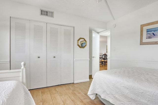 bedroom featuring a closet and light hardwood / wood-style floors