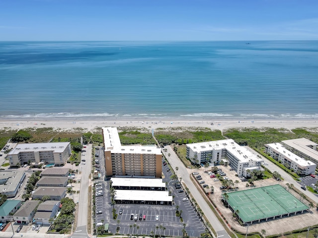 bird's eye view featuring a water view and a view of the beach