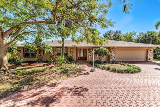 ranch-style home with a garage