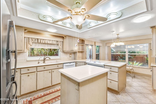 kitchen featuring a kitchen island, stainless steel refrigerator with ice dispenser, a healthy amount of sunlight, and kitchen peninsula