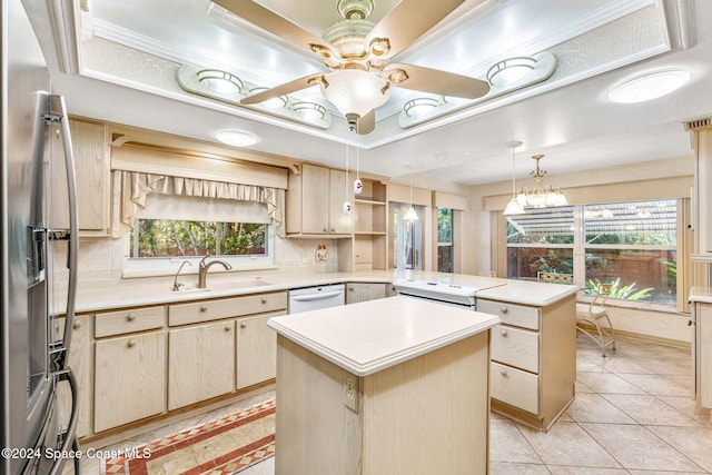 kitchen featuring stainless steel refrigerator with ice dispenser, light countertops, a peninsula, and light brown cabinets