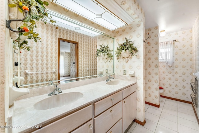 bathroom with vanity, toilet, and tile patterned flooring