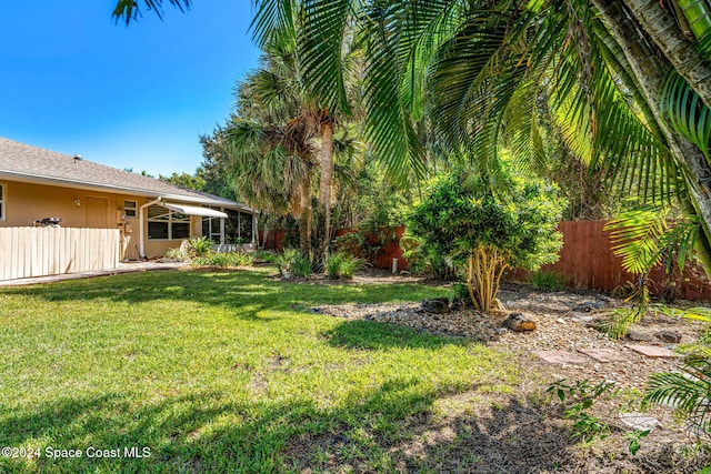 view of yard with fence