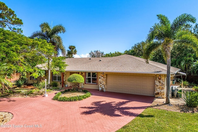 single story home featuring a garage