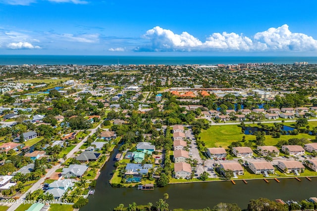 bird's eye view featuring a residential view and a water view