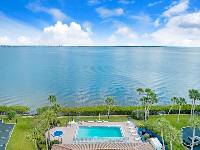 exterior space featuring a patio and a water view