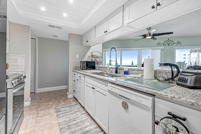 kitchen with sink, dishwasher, white cabinetry, electric range, and a raised ceiling