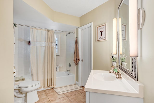 full bathroom with shower / tub combo with curtain, vanity, tile patterned floors, and toilet