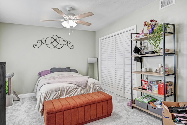 bedroom with ceiling fan and carpet