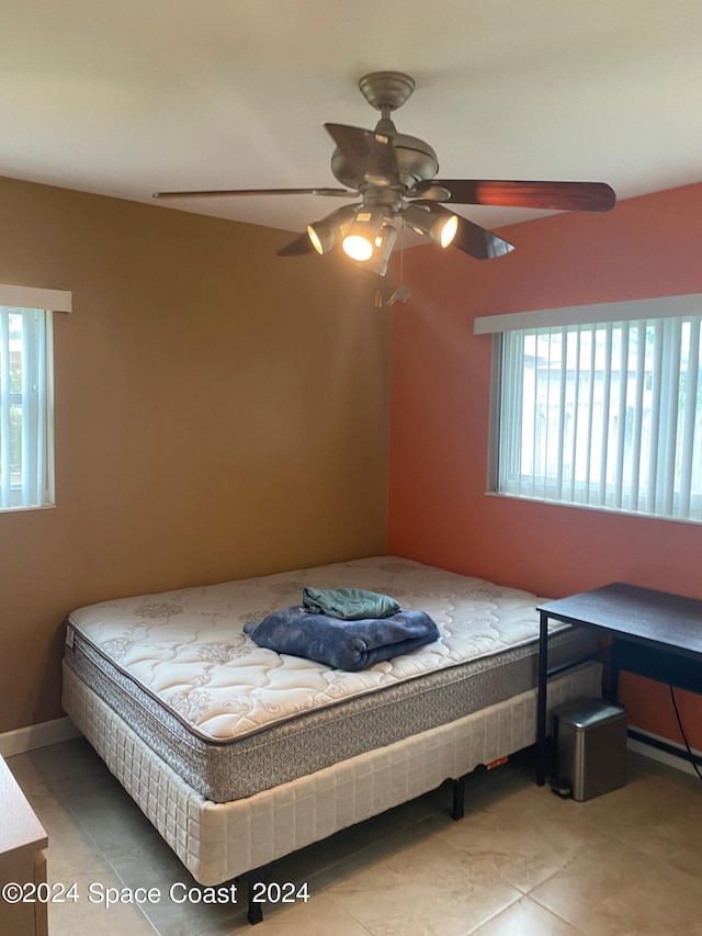 bedroom featuring ceiling fan and light tile patterned floors