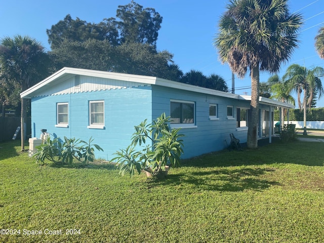 view of property exterior featuring a lawn