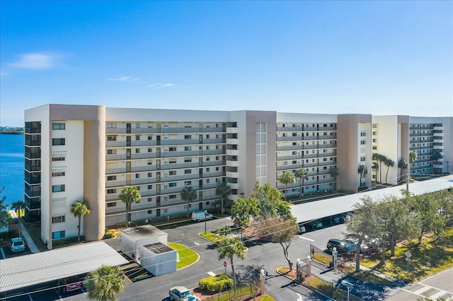 view of building exterior with a water view