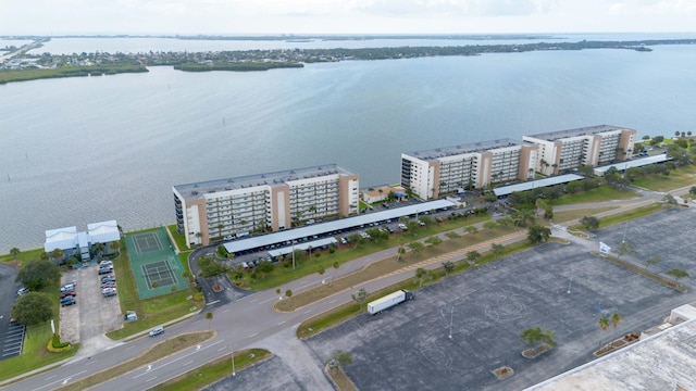 birds eye view of property with a water view
