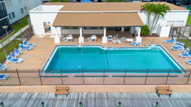 view of swimming pool featuring a patio area