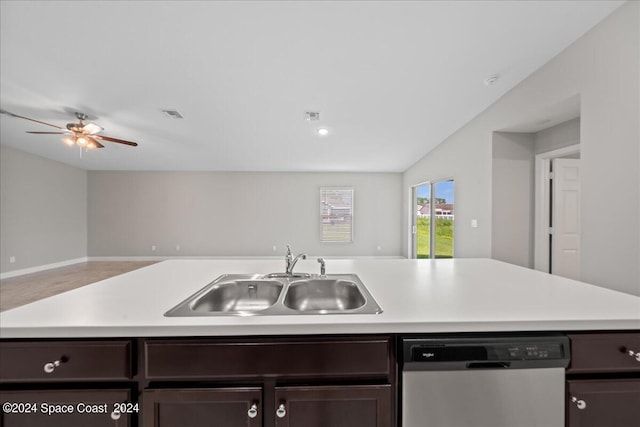 kitchen featuring sink, dishwasher, and dark brown cabinetry