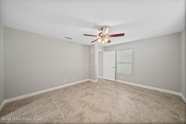 unfurnished room featuring ceiling fan