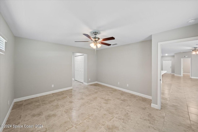 unfurnished room featuring ceiling fan