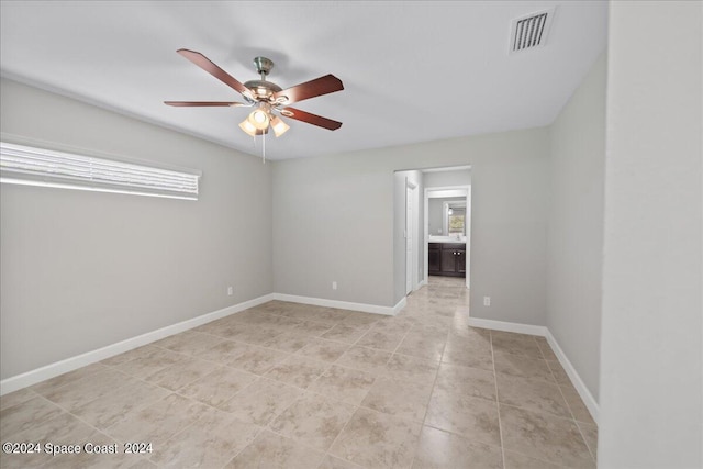 spare room with ceiling fan