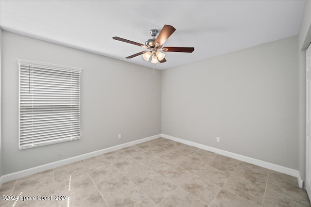 spare room with ceiling fan