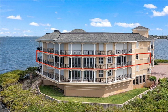 view of building exterior with a water view