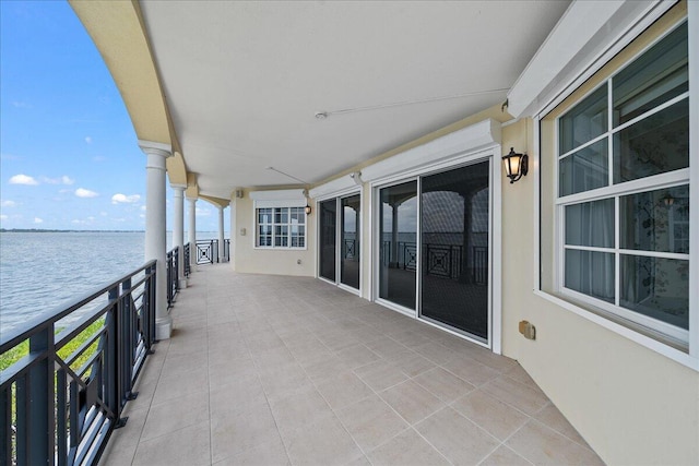 balcony featuring a water view