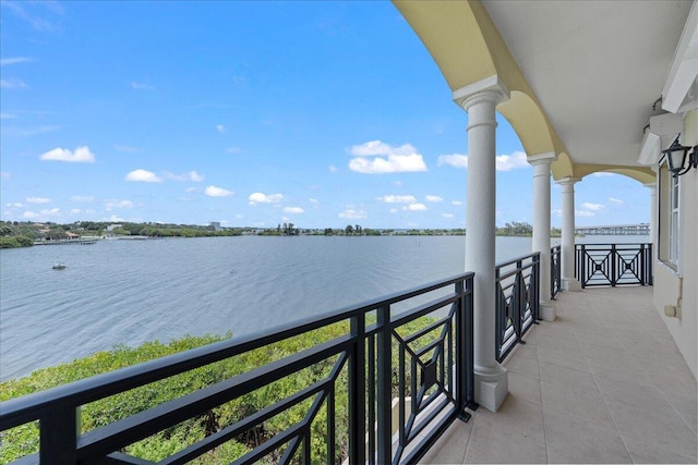 balcony featuring a water view