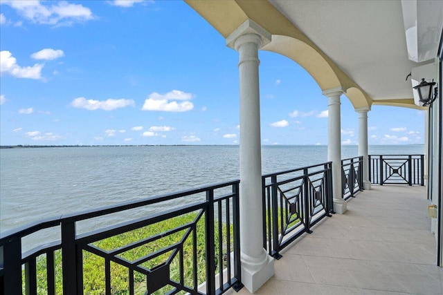 balcony featuring a water view