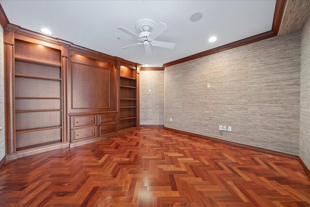 unfurnished room featuring crown molding, ceiling fan, a barn door, and dark parquet flooring