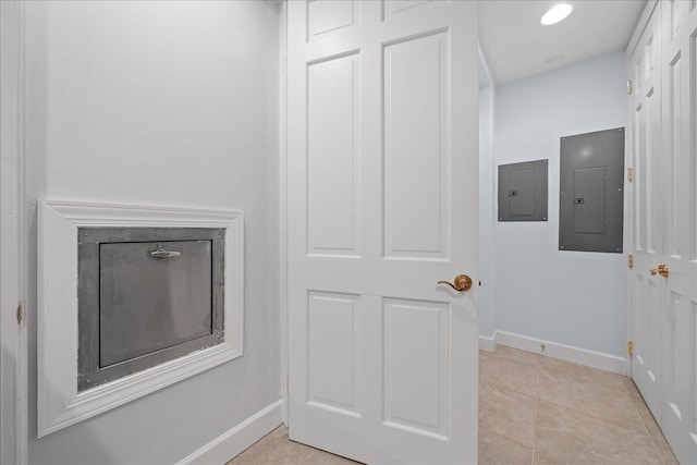 interior details with electric panel and baseboards