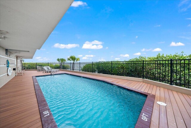 view of pool with a deck