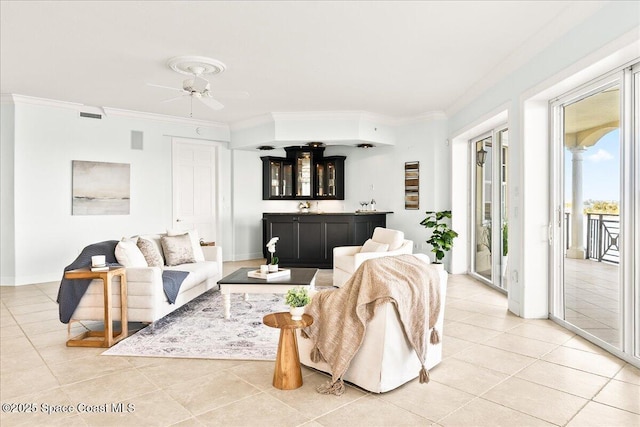 living area featuring ornamental molding, visible vents, and light tile patterned floors