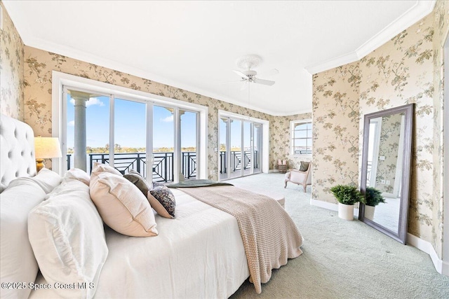 carpeted bedroom featuring access to exterior, ornamental molding, baseboards, and wallpapered walls