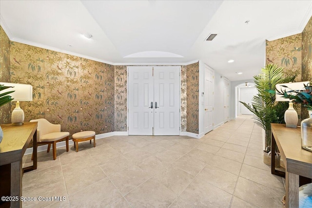 living area with ornamental molding, visible vents, baseboards, and wallpapered walls