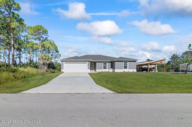 ranch-style home with a carport, a front yard, and a garage