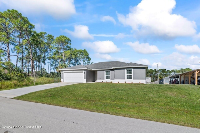 view of front of house with a front lawn and a garage