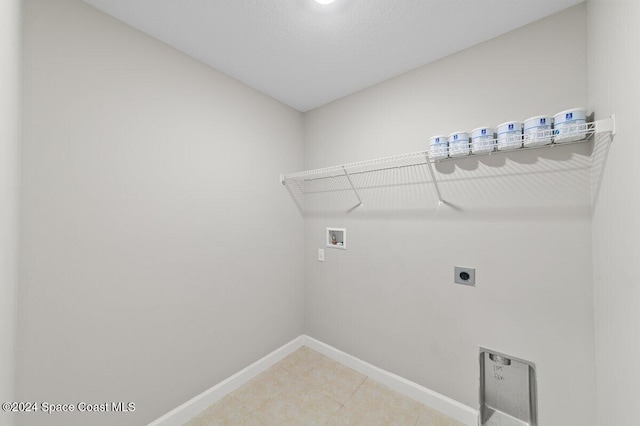 washroom with hookup for an electric dryer and washer hookup