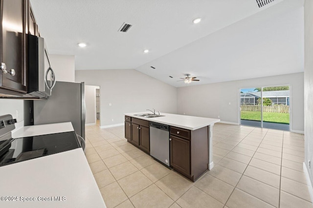 kitchen featuring sink, vaulted ceiling, ceiling fan, an island with sink, and appliances with stainless steel finishes