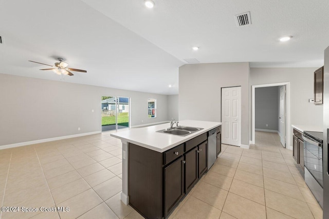 kitchen with a center island with sink, stainless steel electric range, ceiling fan, sink, and lofted ceiling