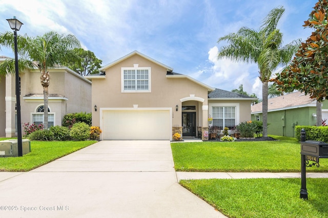 view of front of property featuring a garage and a front lawn