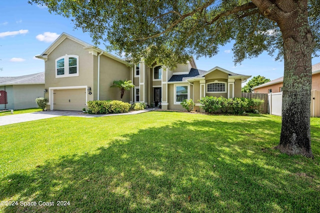 view of front facade with a garage and a front yard