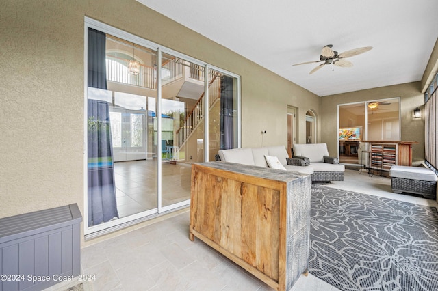 interior space with ceiling fan