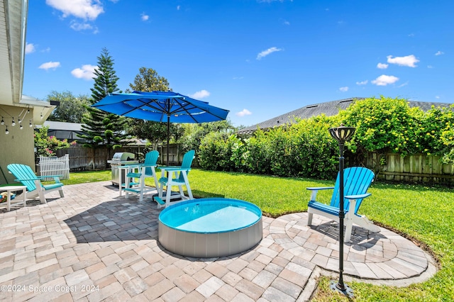 view of patio with a grill