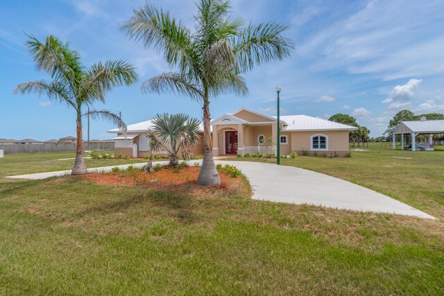 ranch-style house with a gazebo and a front lawn